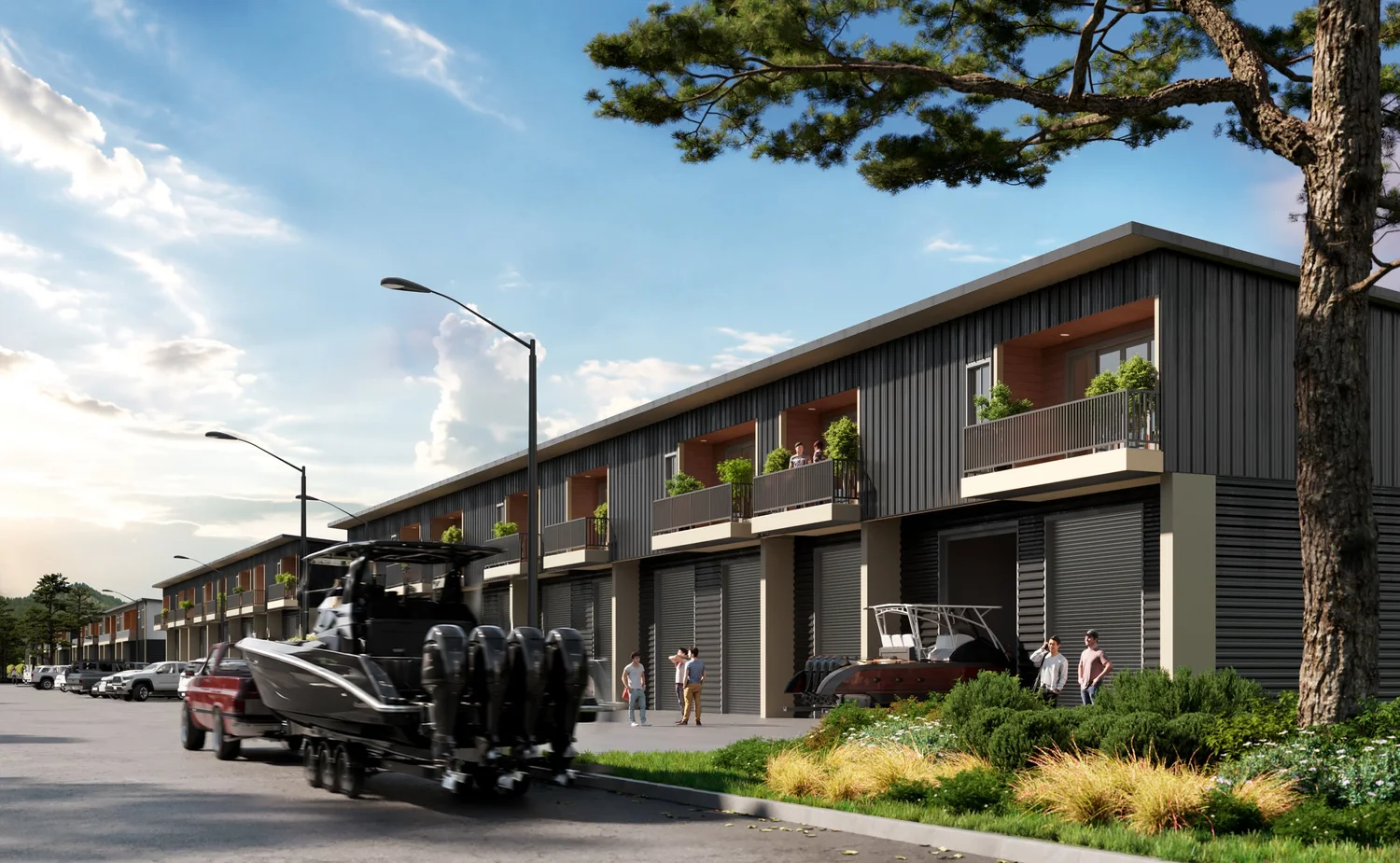 North Shore Landing street view rendering — luxury shop residences in Somers, Montana with boats and trucks parked outside oversized garage doors