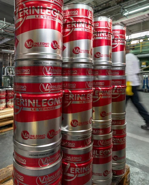 Red and silver Verinlegno coating containers stacked at the manufacturing site