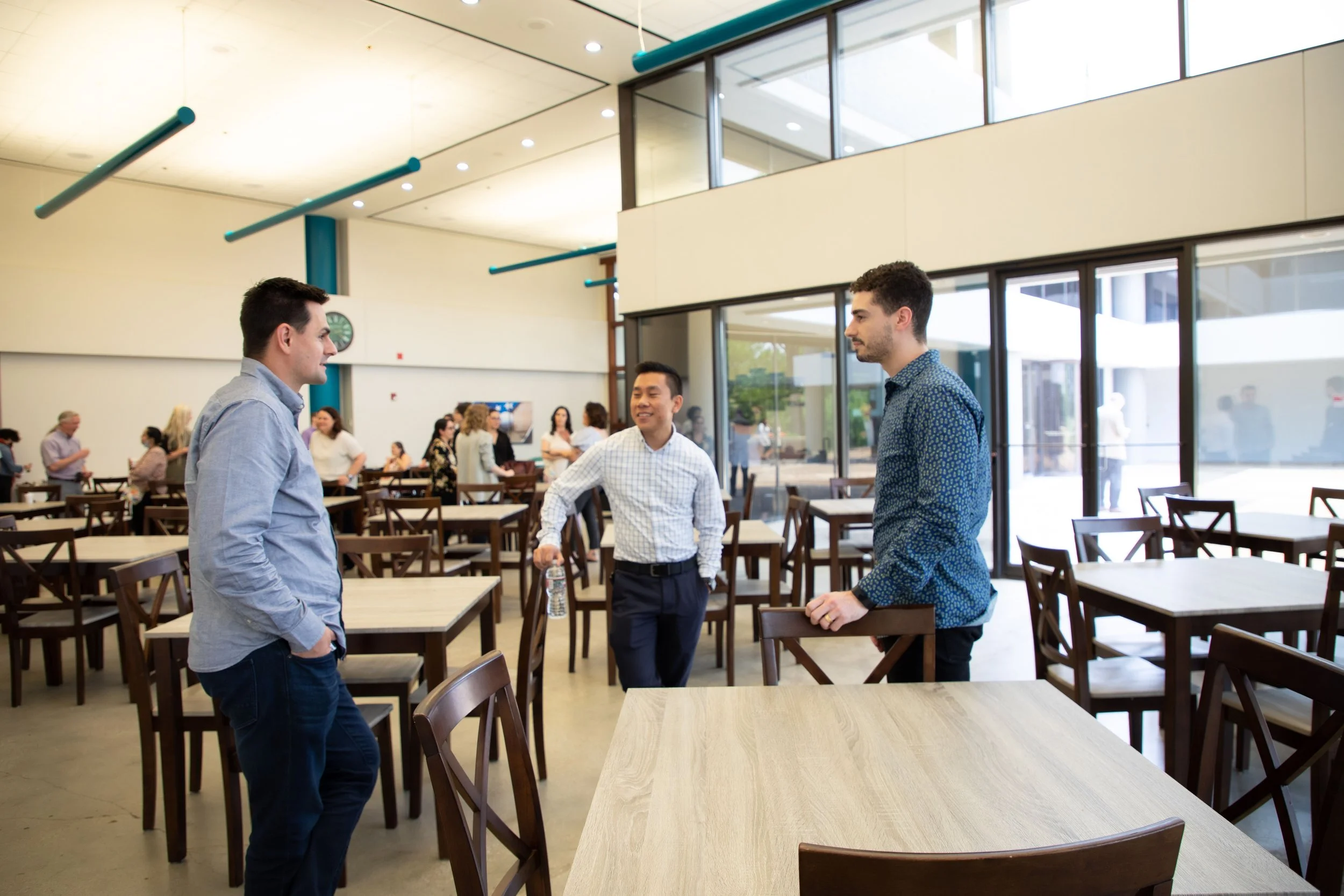 Employees talking in a corporate cafeteria