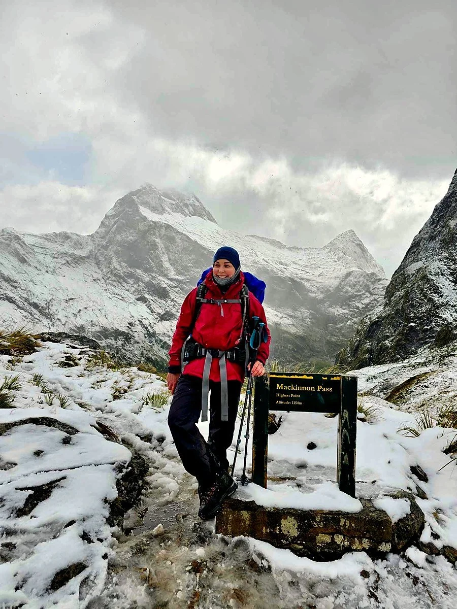 Natalie Rasmussen, founder, hiking in snow at Mackinnon Pass