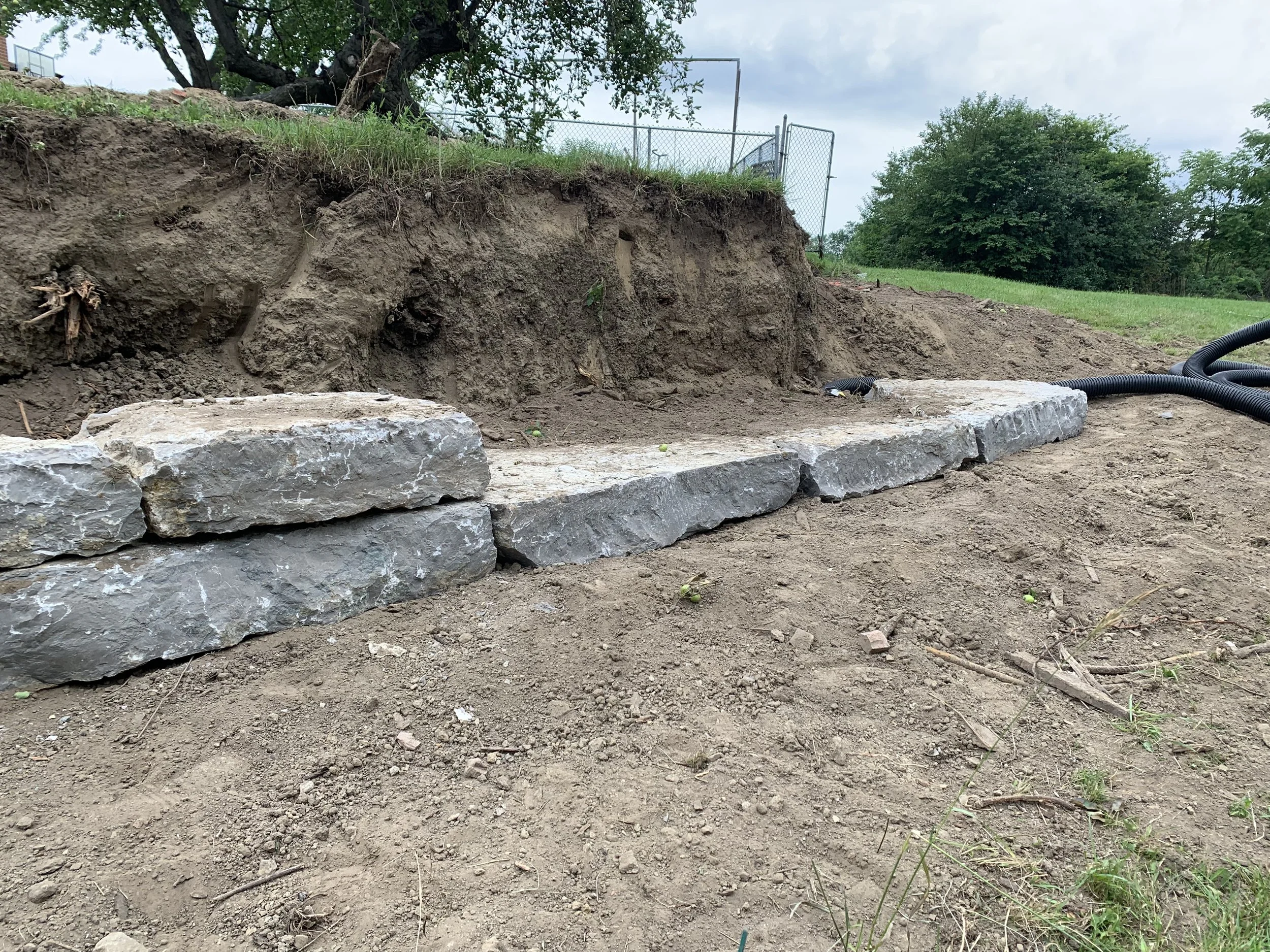 Armour stone base course – Brick Aid Masonry