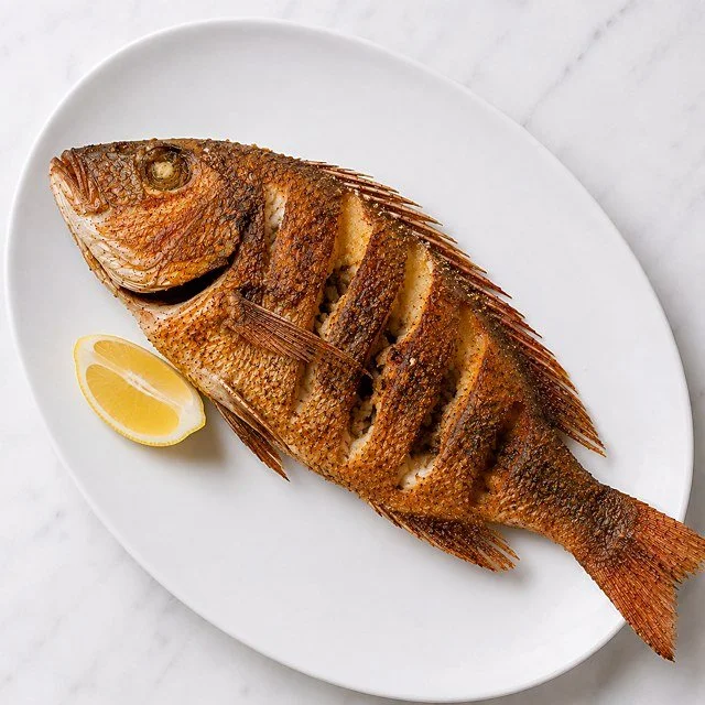 Whole fried red snapper with lemon