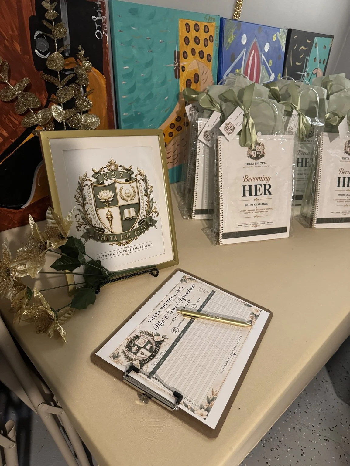Theta Phi Zeta Becoming Her welcome materials displayed at the Meet and Greet Mixer