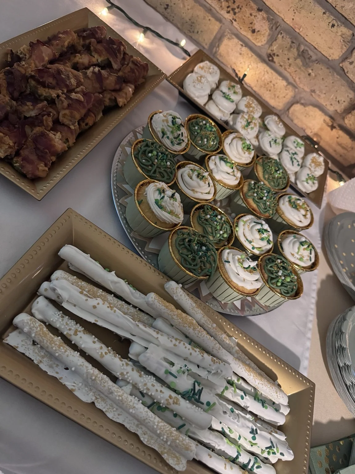Green and gold cupcakes and dipped pretzels