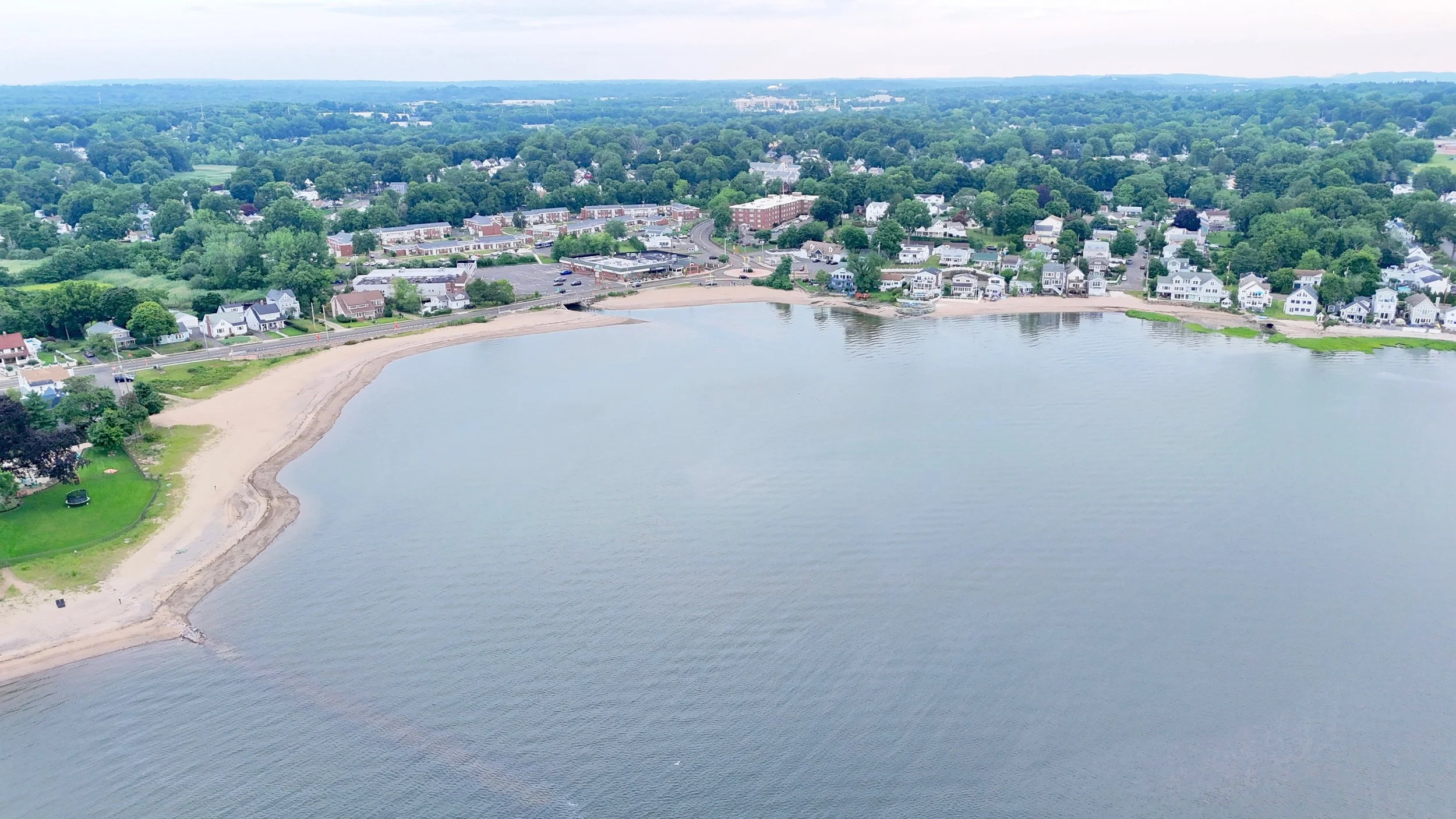 Wide aerial view of Oyster River Beach(R) of West Haven and Woodmont Beach(L) of Milford. 
