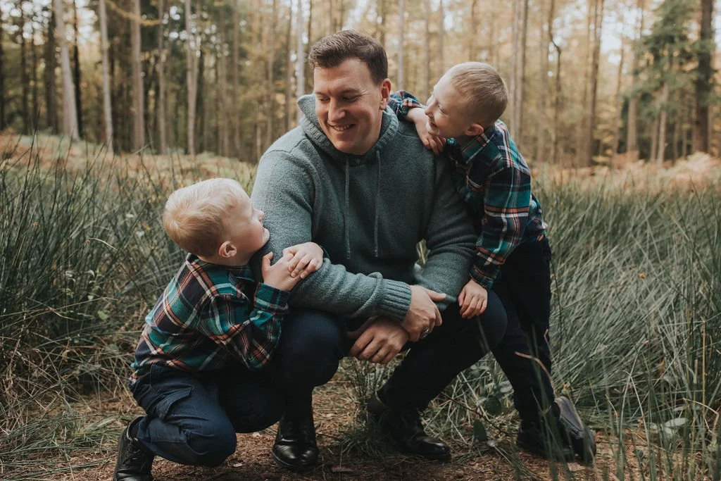 Woody sharing a moment outdoors with his two sons