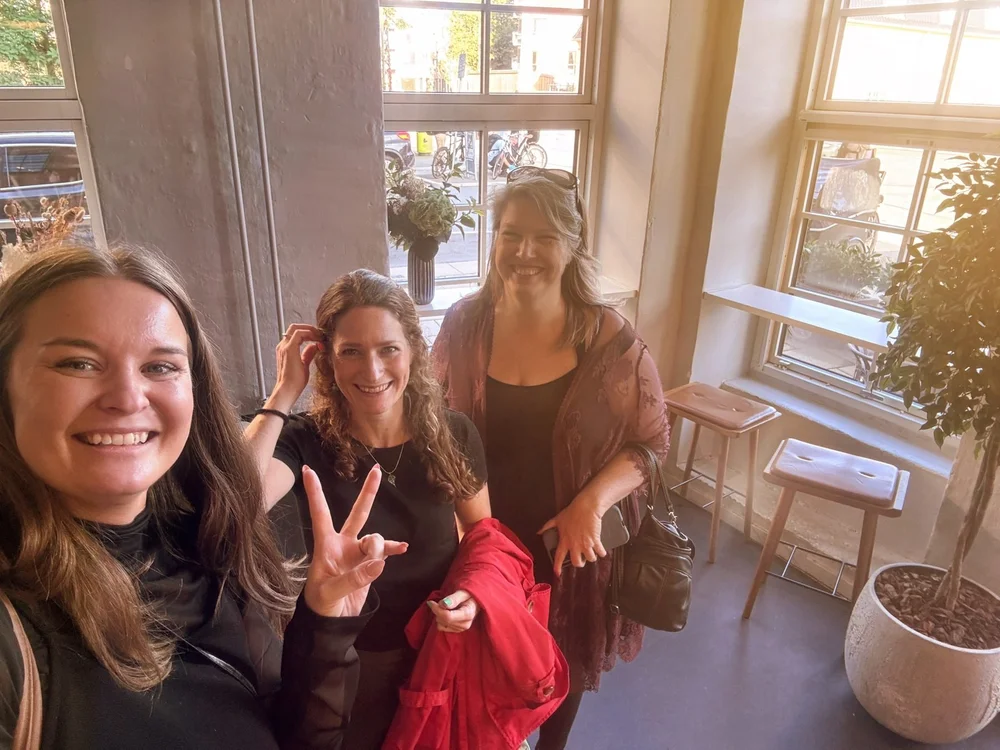 Three members taking a selfie