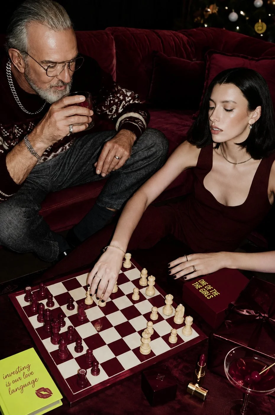 Playing chess with a One of the Girls gift box beside the board