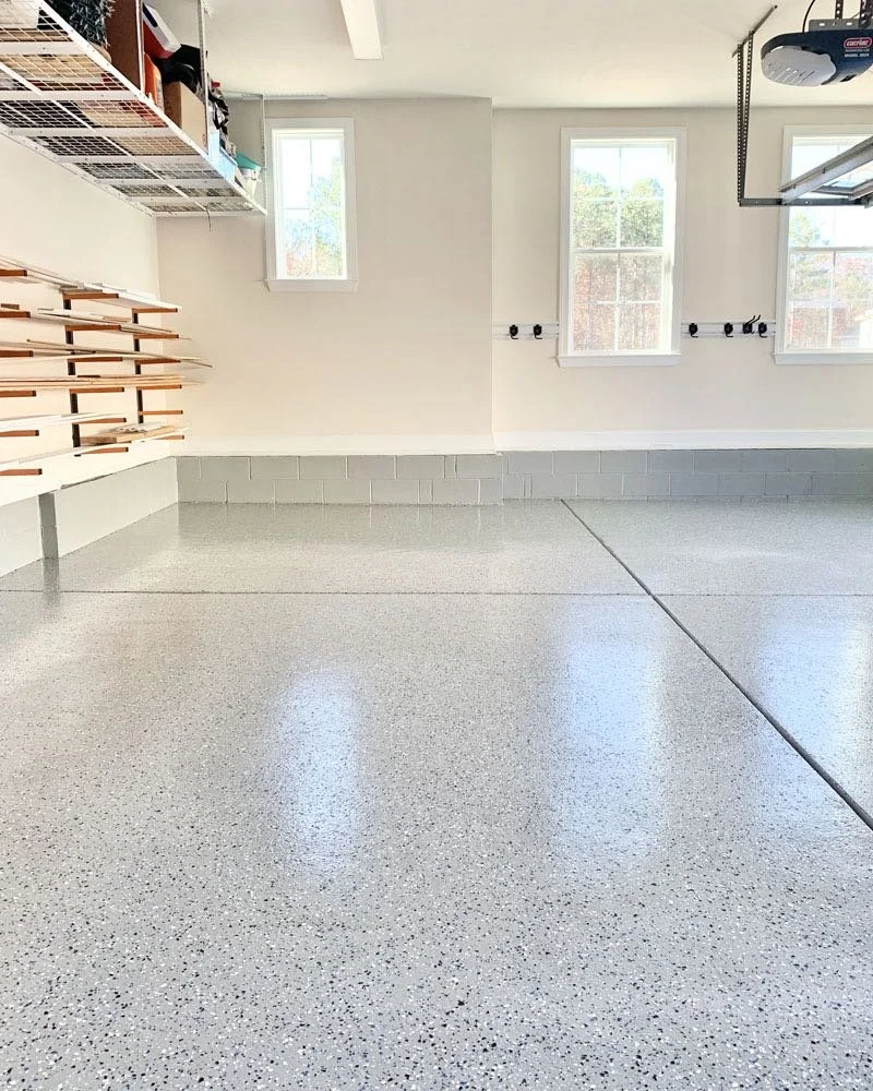 Bright finished garage floor by Surface Haus