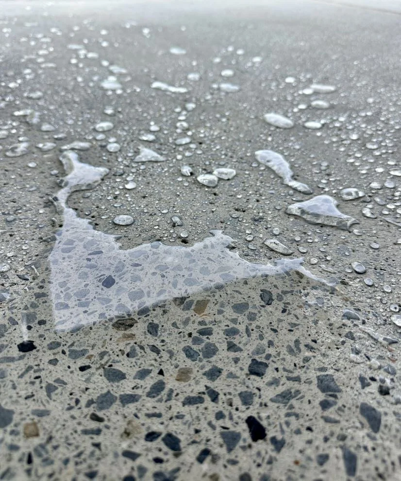 Sealed concrete with water beading