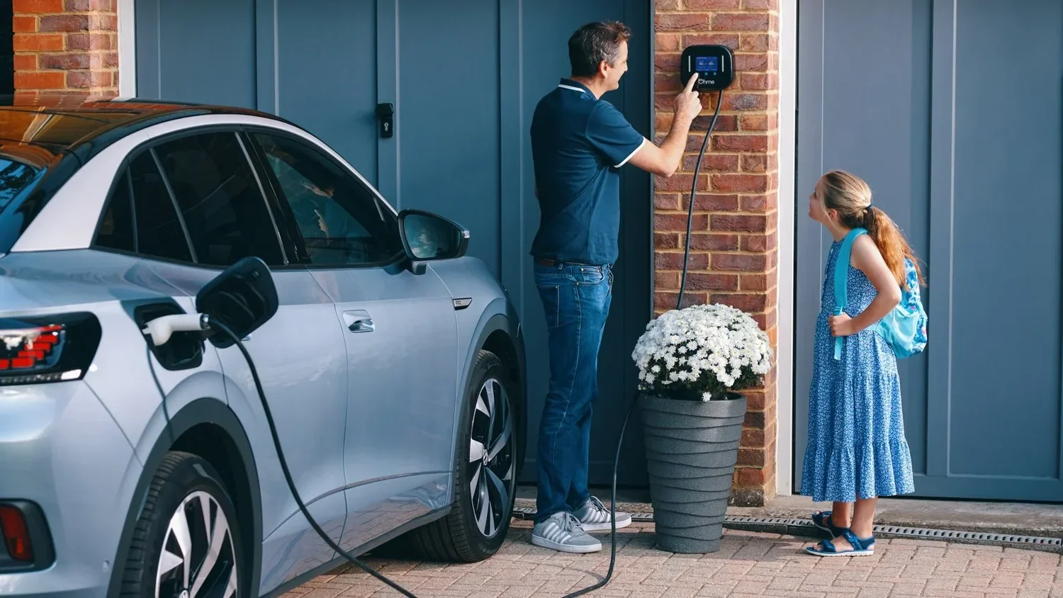 Family using an Ohme home EV charger — lifestyle photography