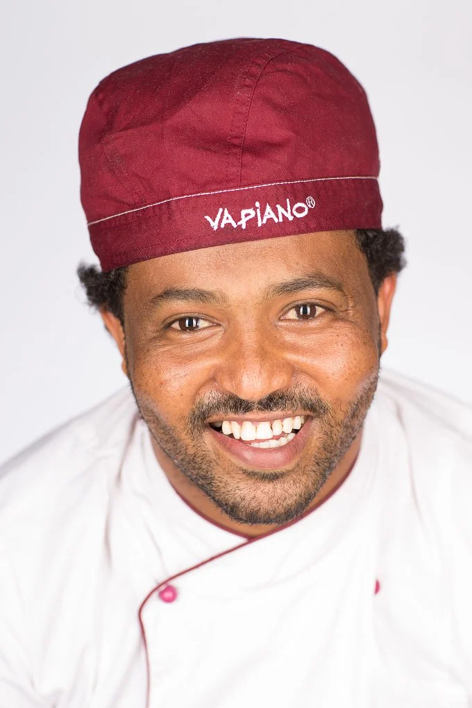 Vapiano staff portrait — laughing team member