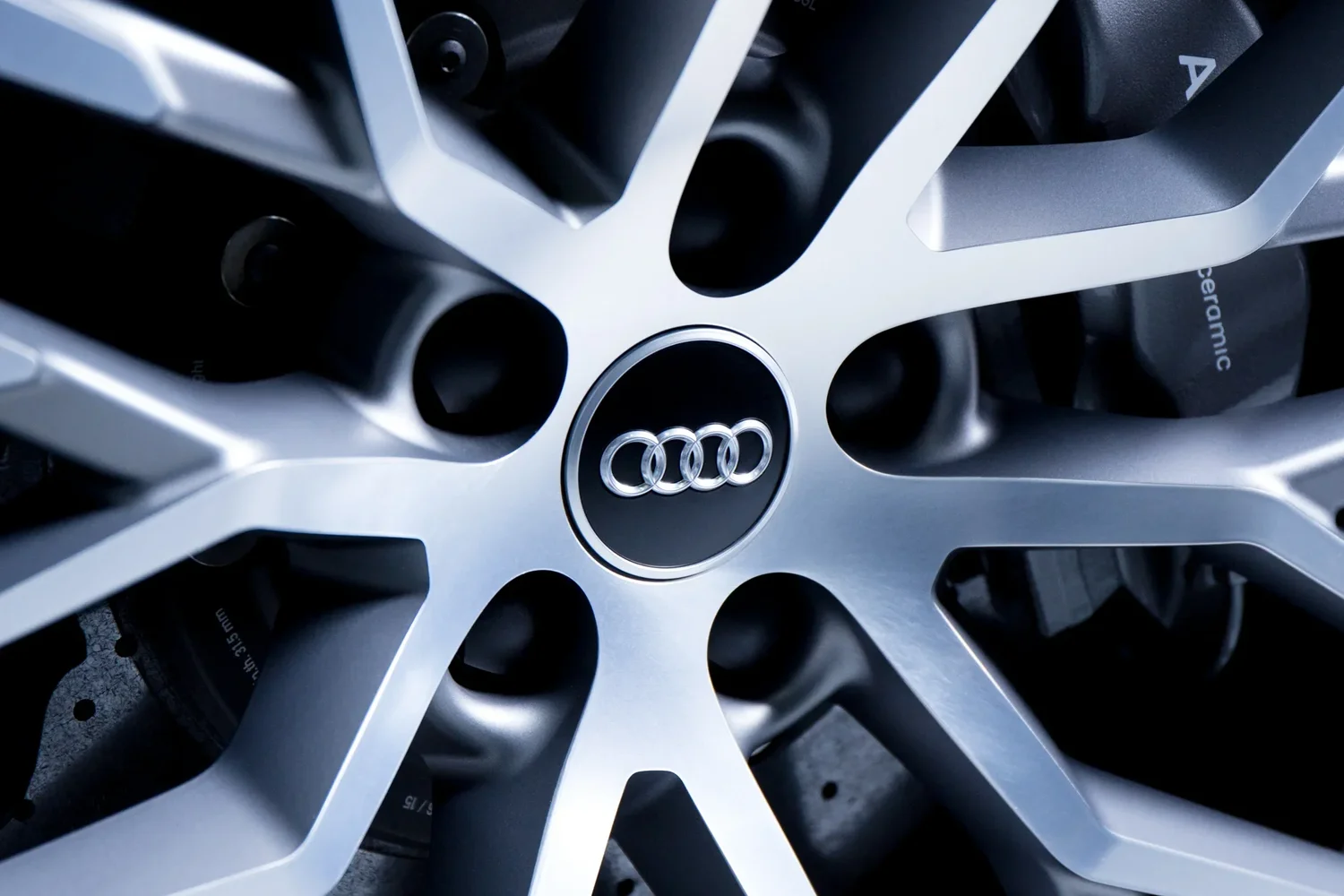 Audi wheel and blue bodywork detail — automotive photography
