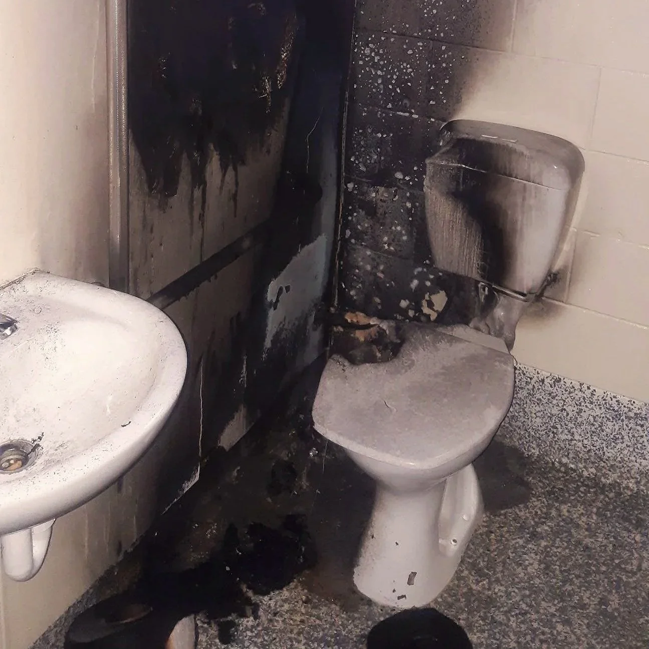 Fire damaged toilet and bathroom before insurance repair, Pemberton Park