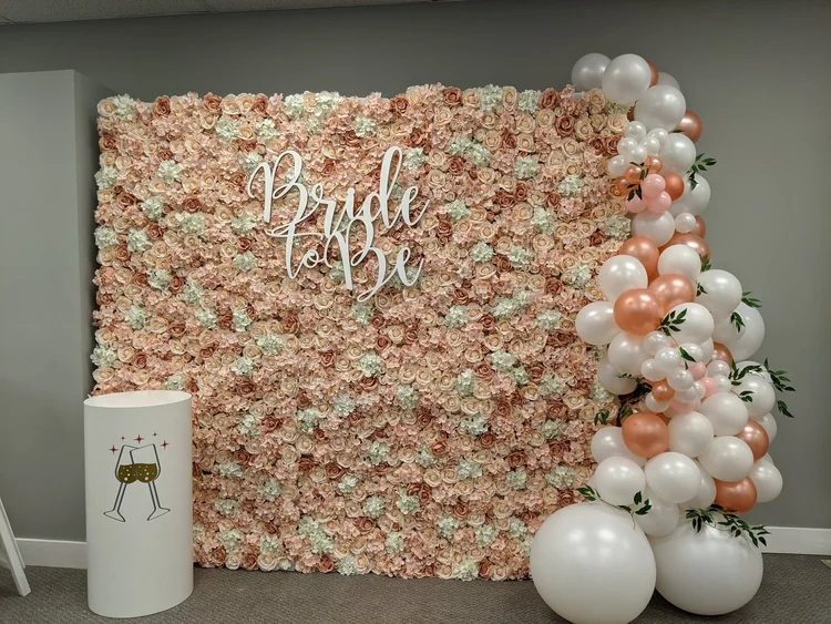 Blush rose flower wall styled for a bridal shower