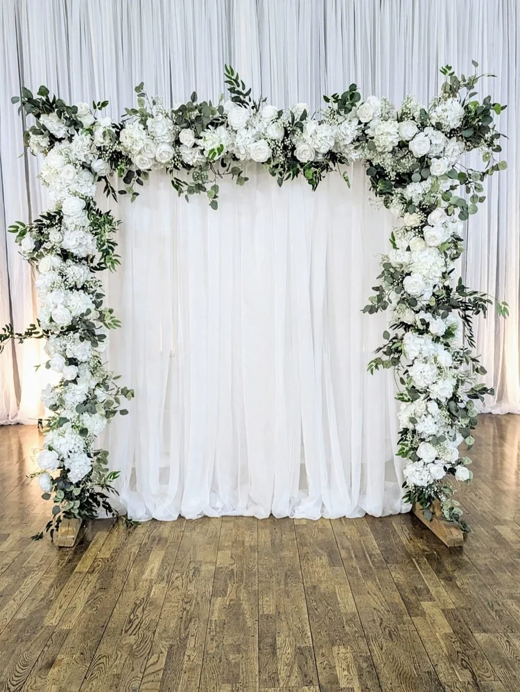 Full silk floral archway with white drapery