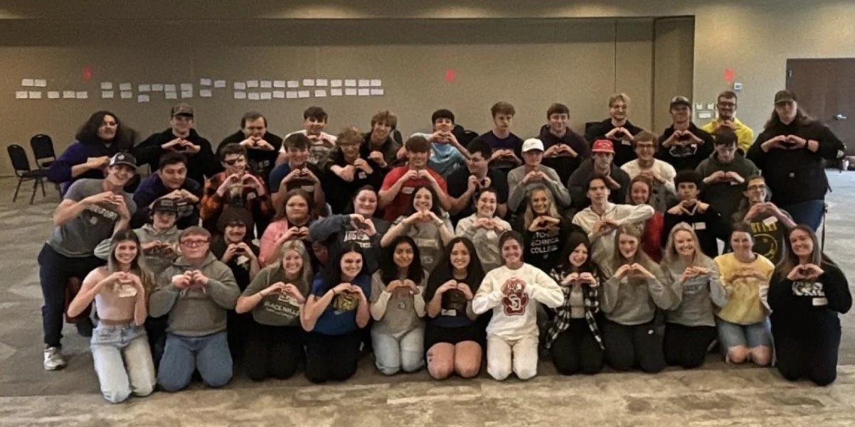 A school staff together at a Humanity Launch in-service