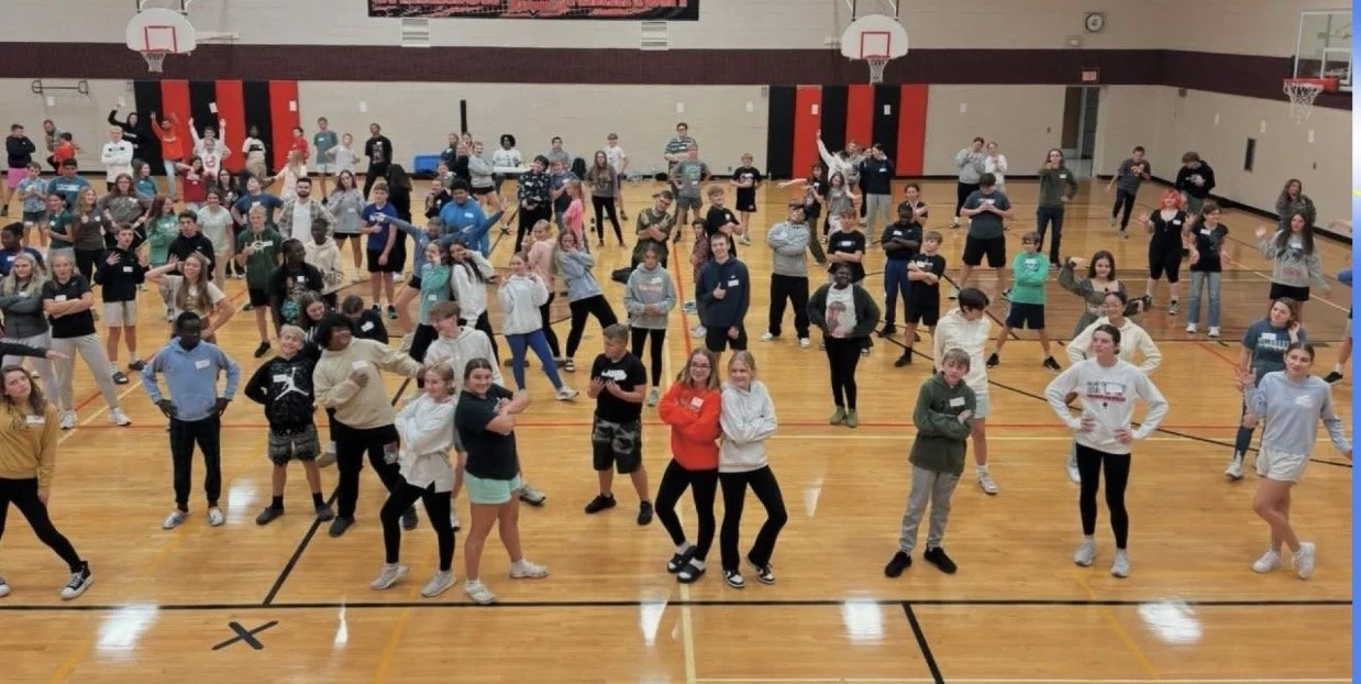 Students on their feet during a Humanity Launch retreat