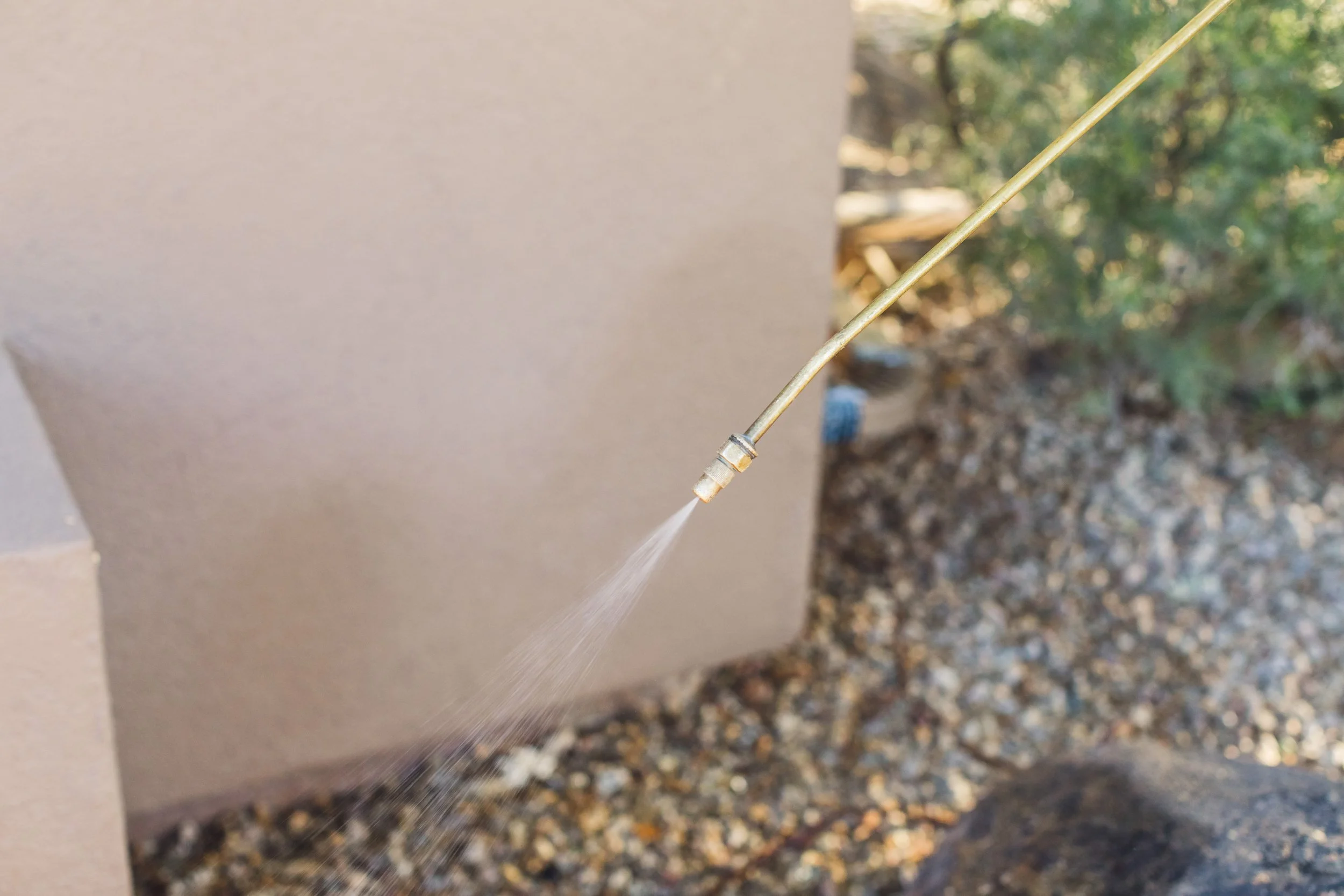 Russell Pest Control expert performing safe environmental yard treatment
