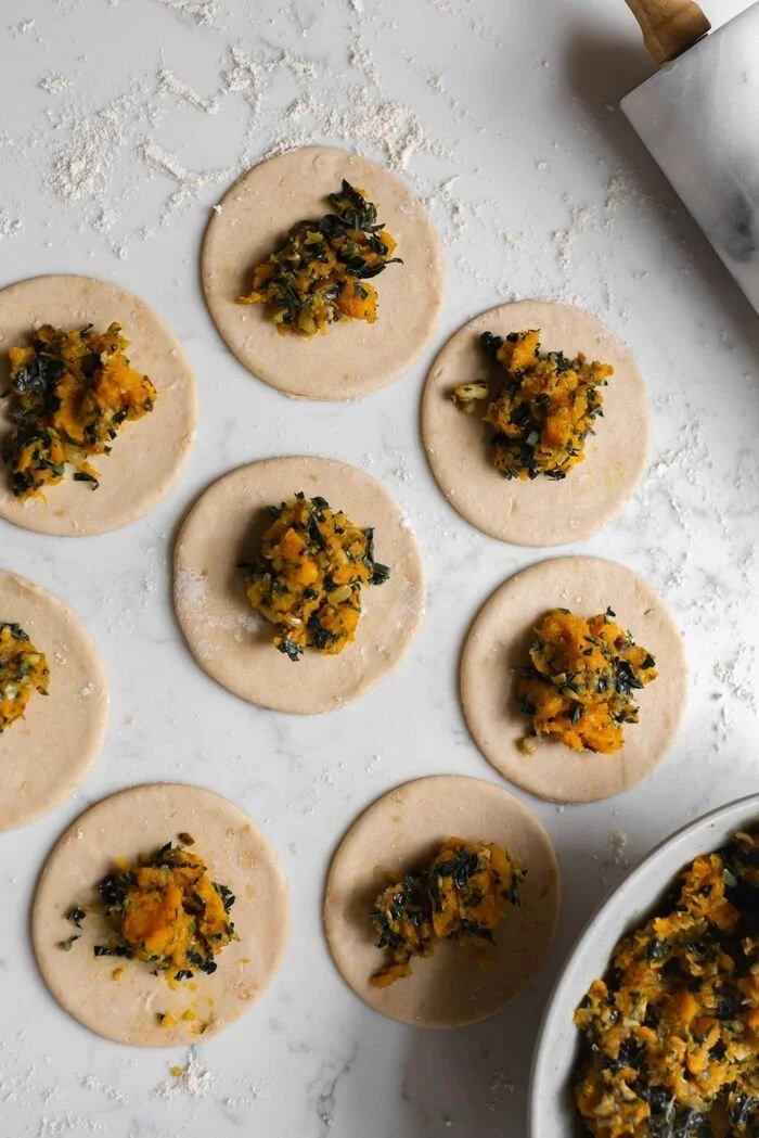 Stuffed pastries filled with greens and squash