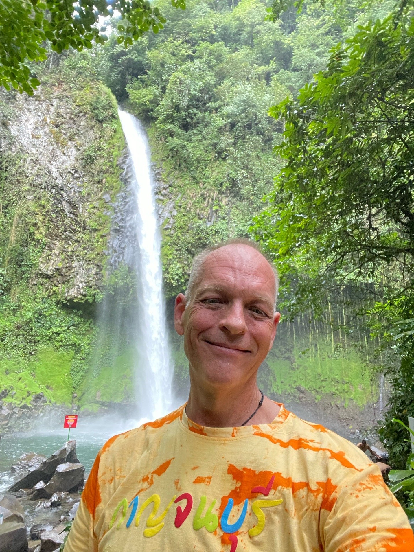Andy at La Fortuna waterfall in the rainforest