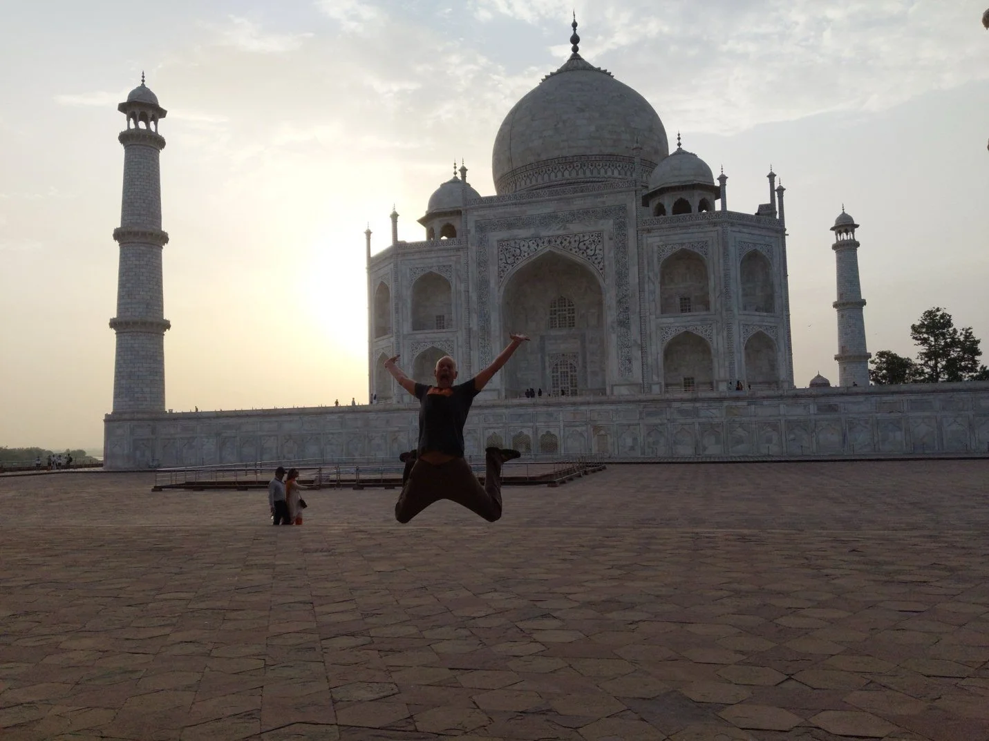 Andy leaping in front of the Taj Mahal at sunrise