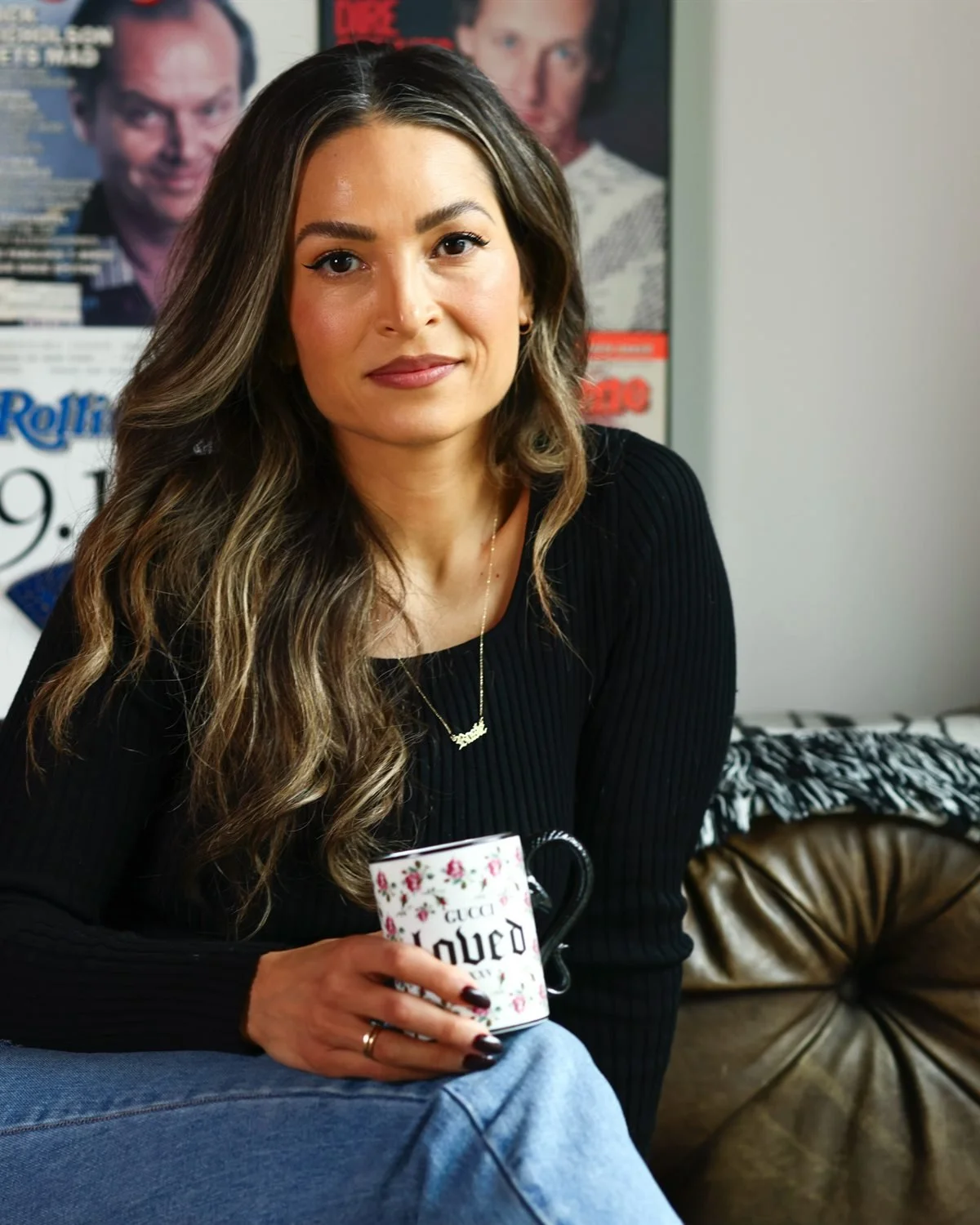Rosie Acosta, mental health coach, holding a loved mug
