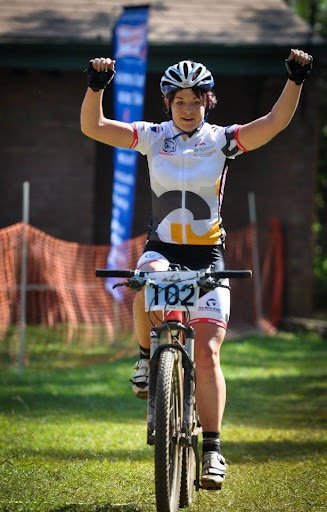 Amy Wakefield winning a provincial cross-country MTB race in 2012 with her first sponsor Ghost Bikes