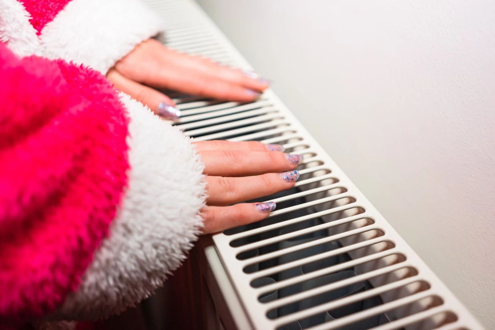Technician inspecting an attic furnace during maintenance