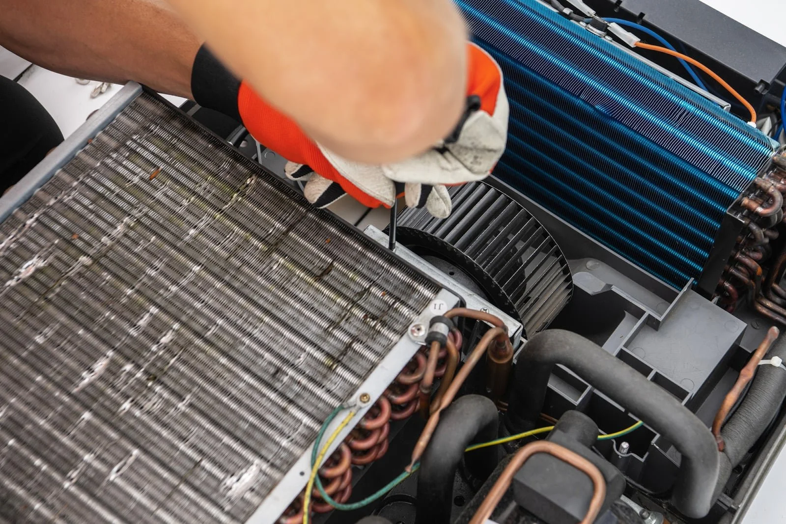 Fix My Air DFW technicians setting a condenser unit at a Fort Worth home