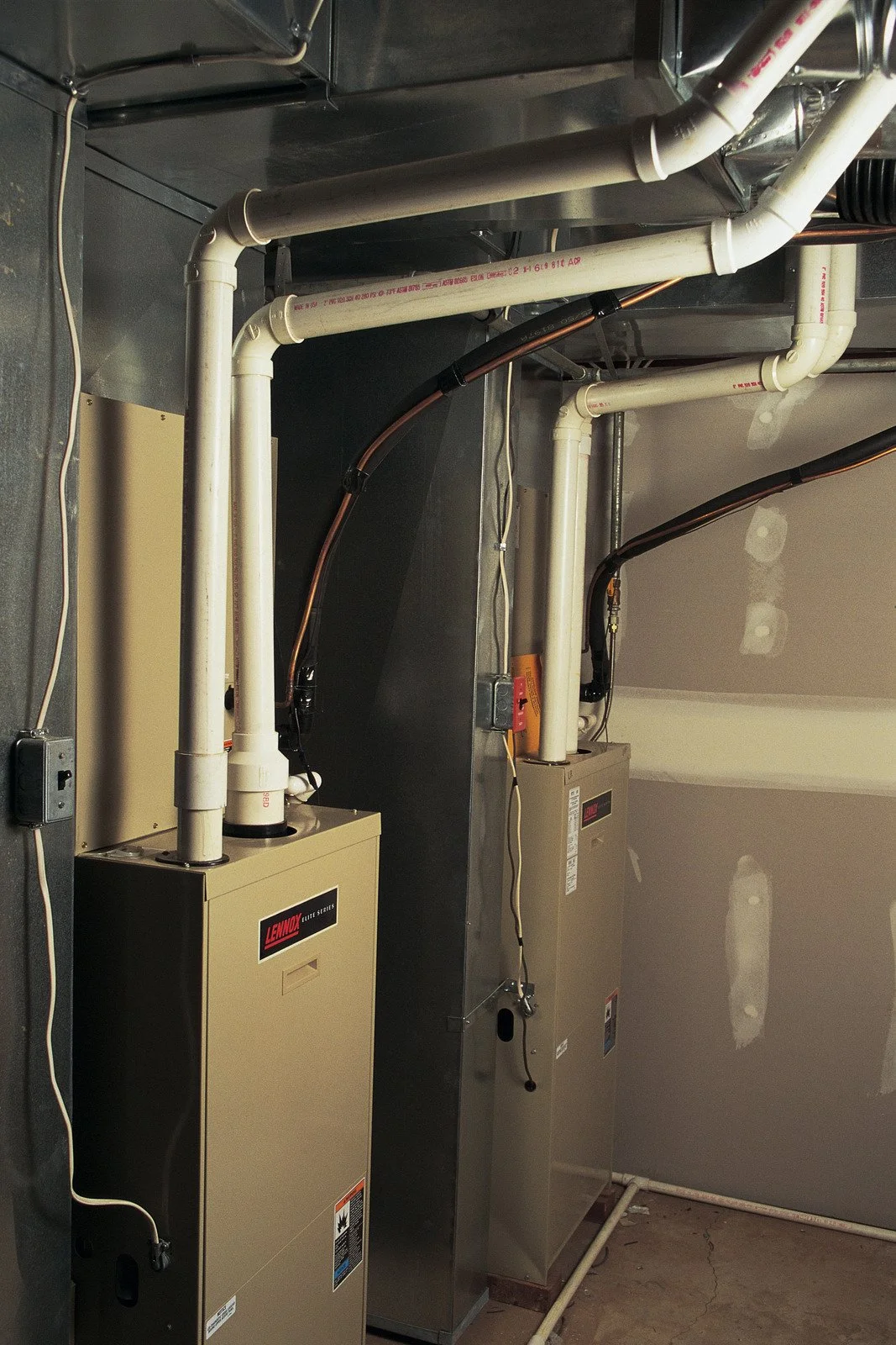 Fix My Air DFW technician working on a furnace capacitor at a Fort Worth home