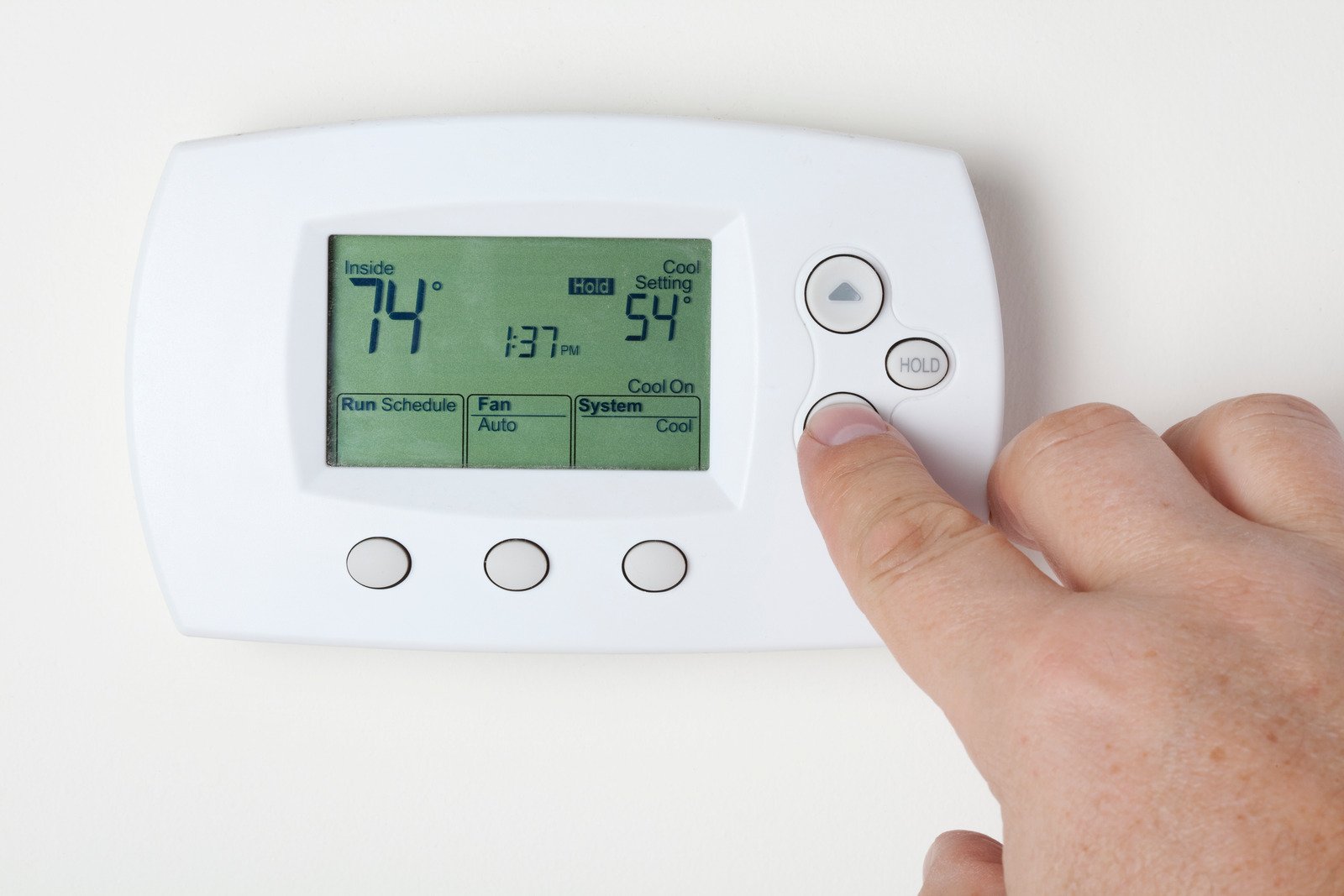 Fix My Air DFW technician installing a Honeywell thermostat in a Fort Worth home