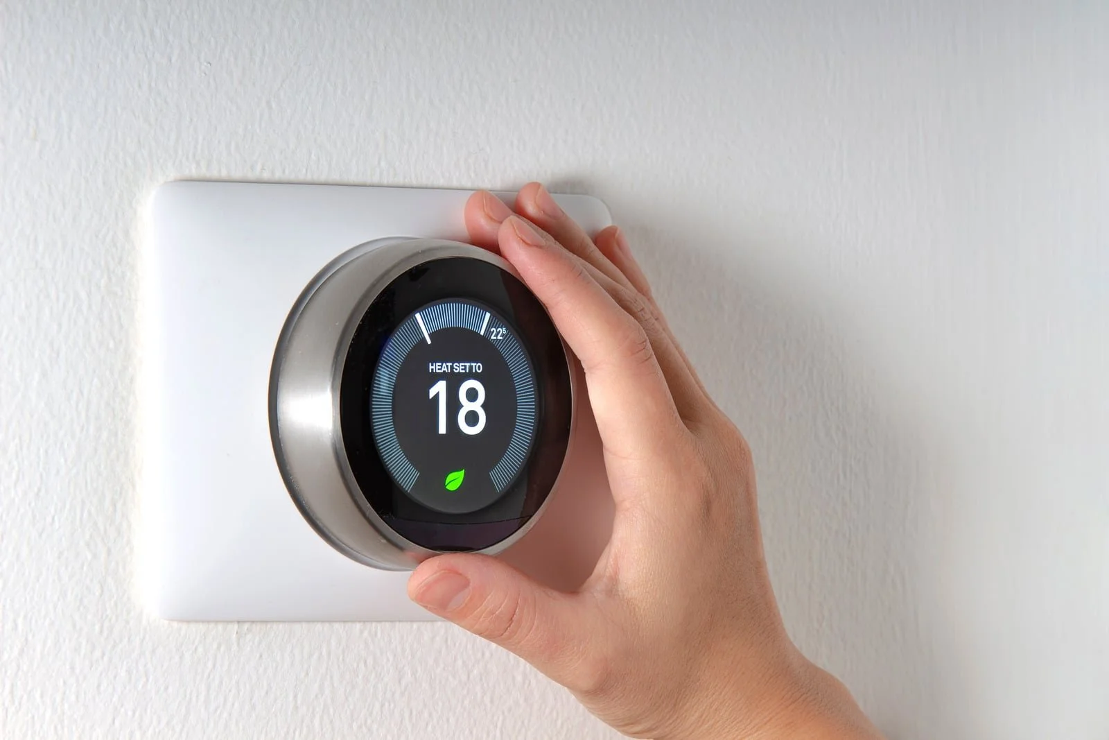 Fix My Air DFW technician installing a Google Nest thermostat in a Fort Worth home