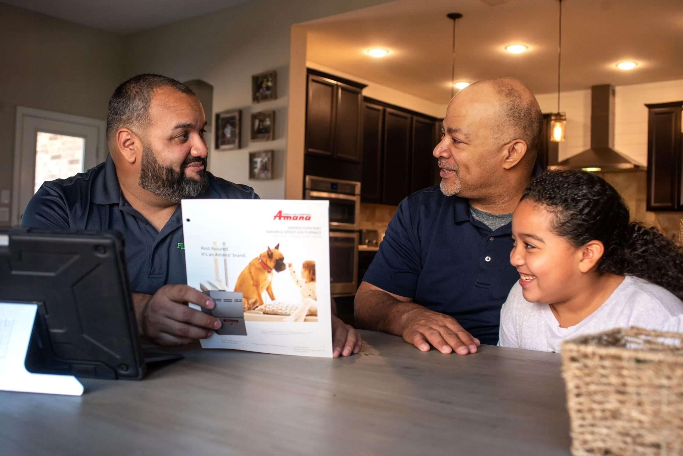Augie reviewing financing and system options with a Fort Worth family