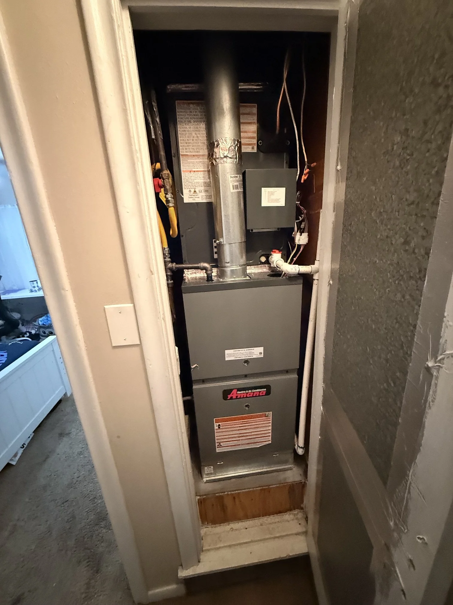 Fix My Air DFW technician installing a furnace in a Fort Worth attic
