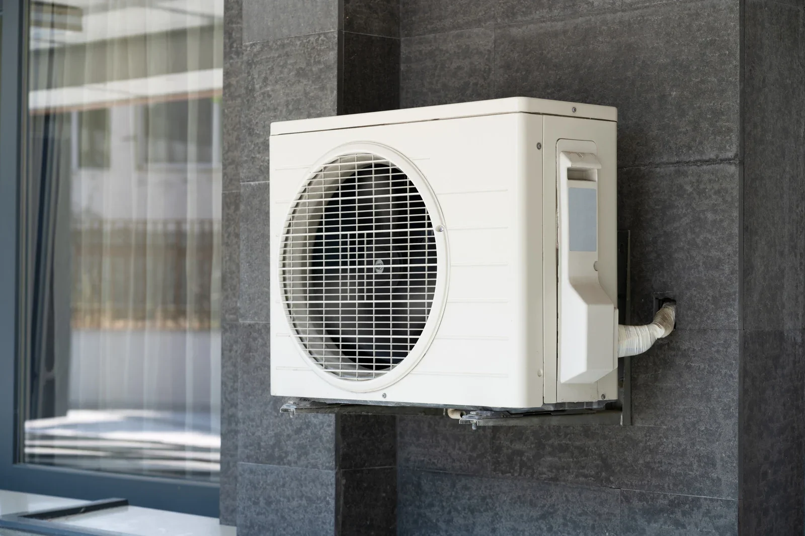 Fix My Air DFW technician working on a condenser fan motor at a Fort Worth home