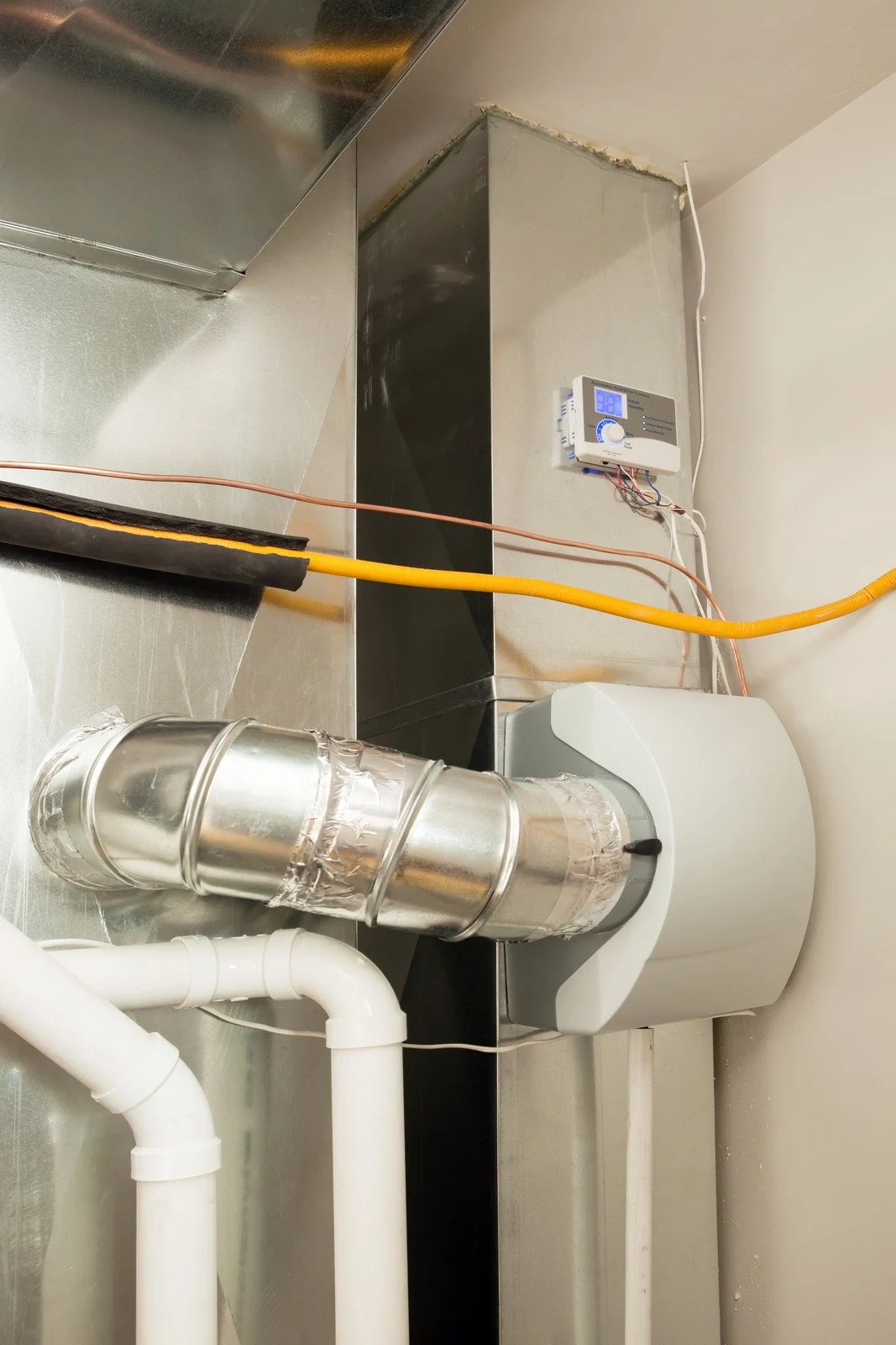 Fix My Air DFW technician installing a furnace in a Fort Worth attic