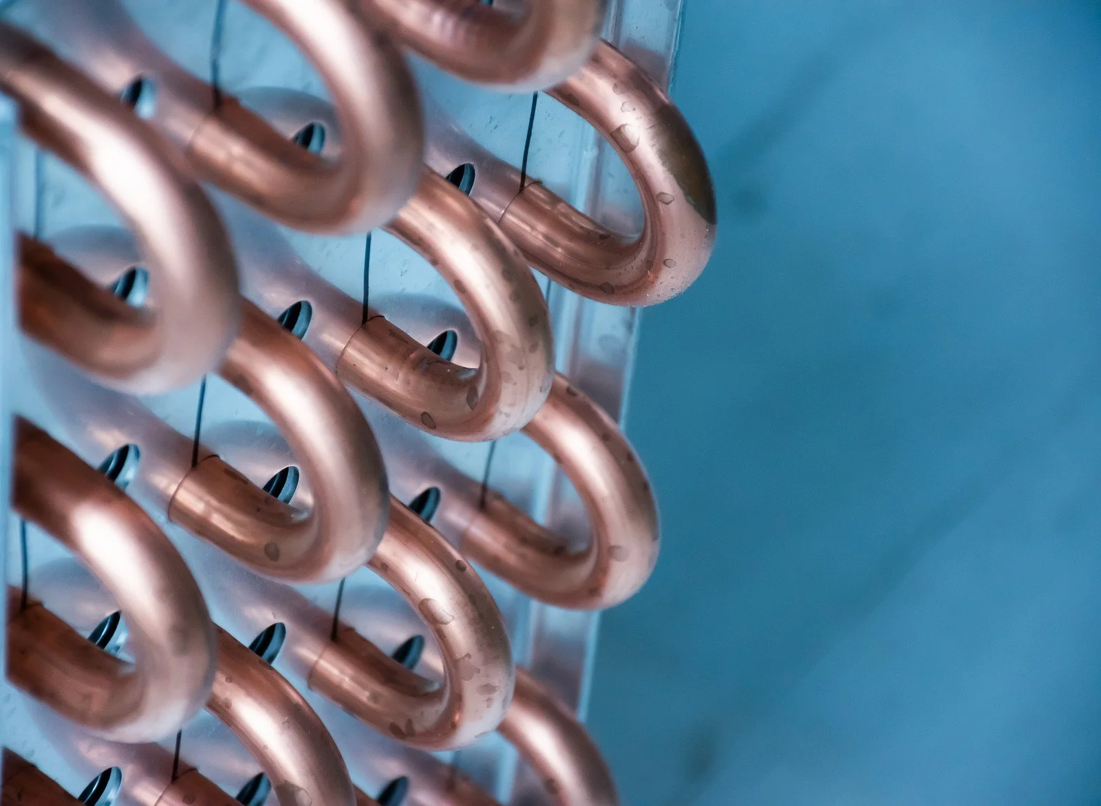 Fix My Air DFW technician working on a condenser coil at a Fort Worth home