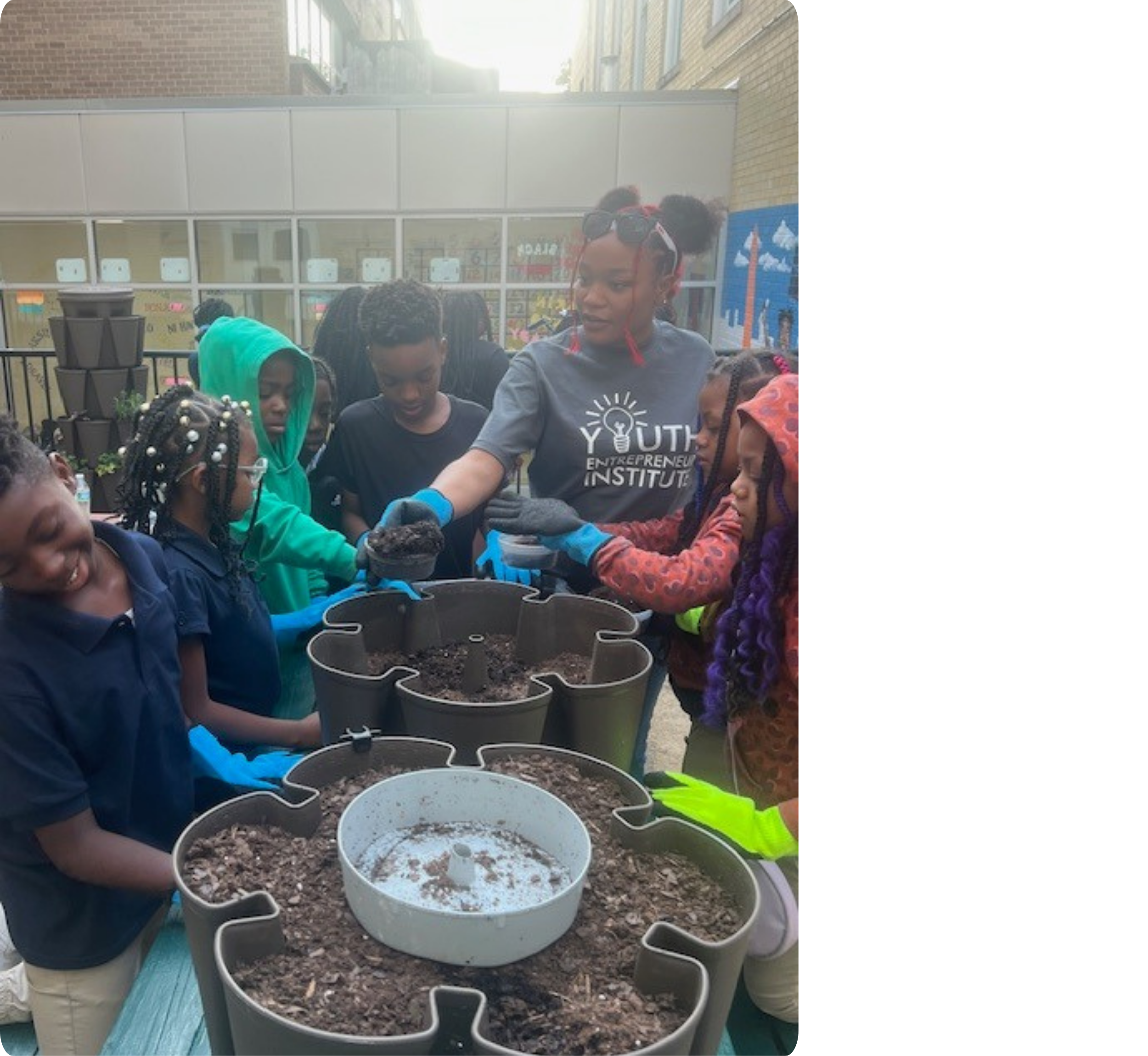 Students gardening and creating products in BizGrow