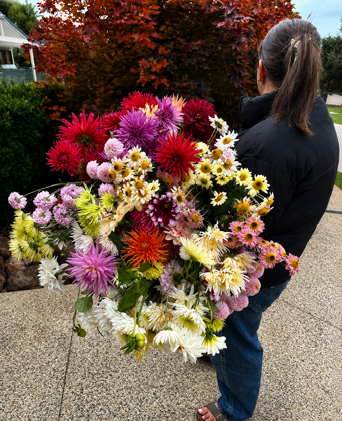 Woman holding a colourful bouquet of flowers