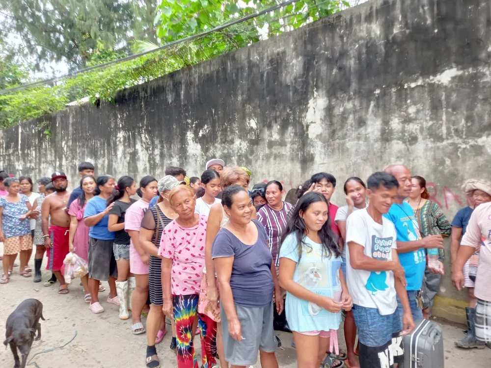 Families gathering for food distribution