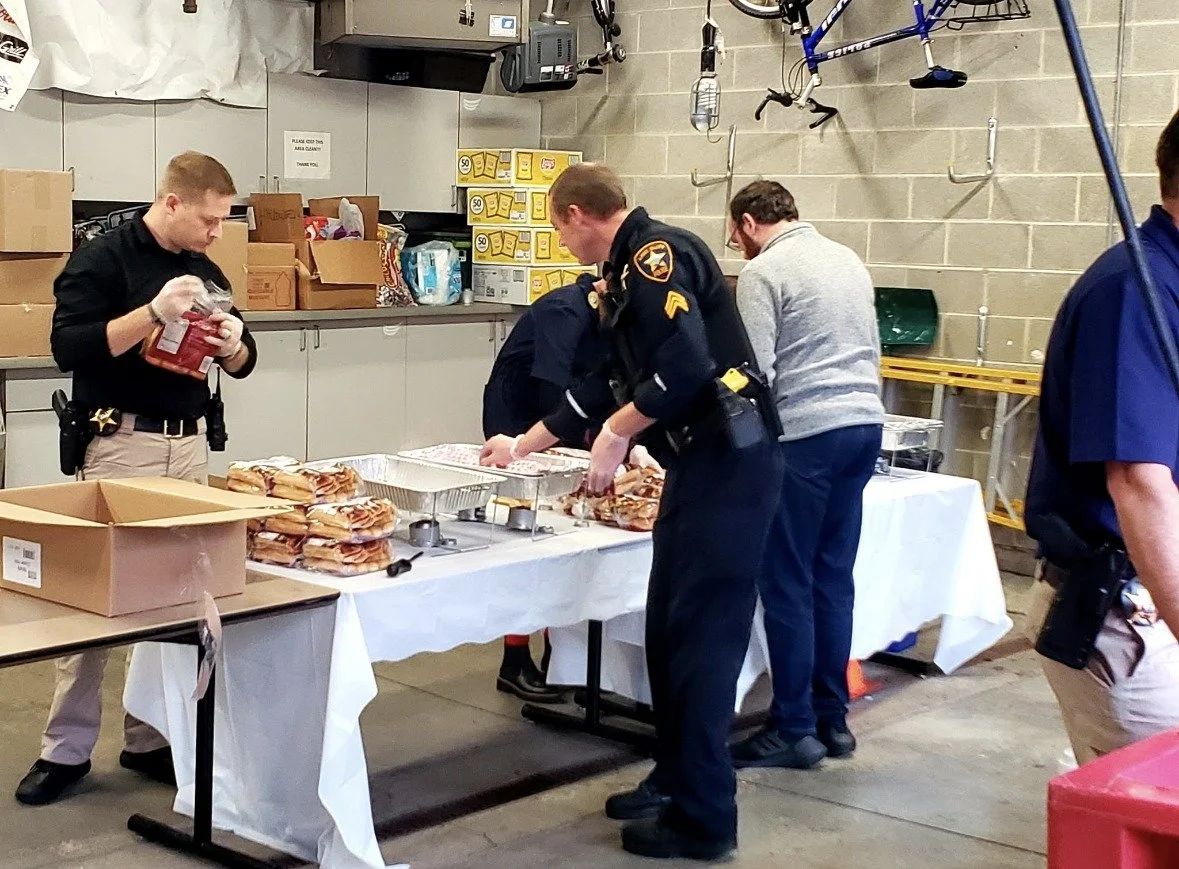 Lake Bluff police officers and volunteers serve as many as 2,000 hot dogs, snacks and beverages before trick-or-treating begins. The tradition has brought neighbors together since 1987.