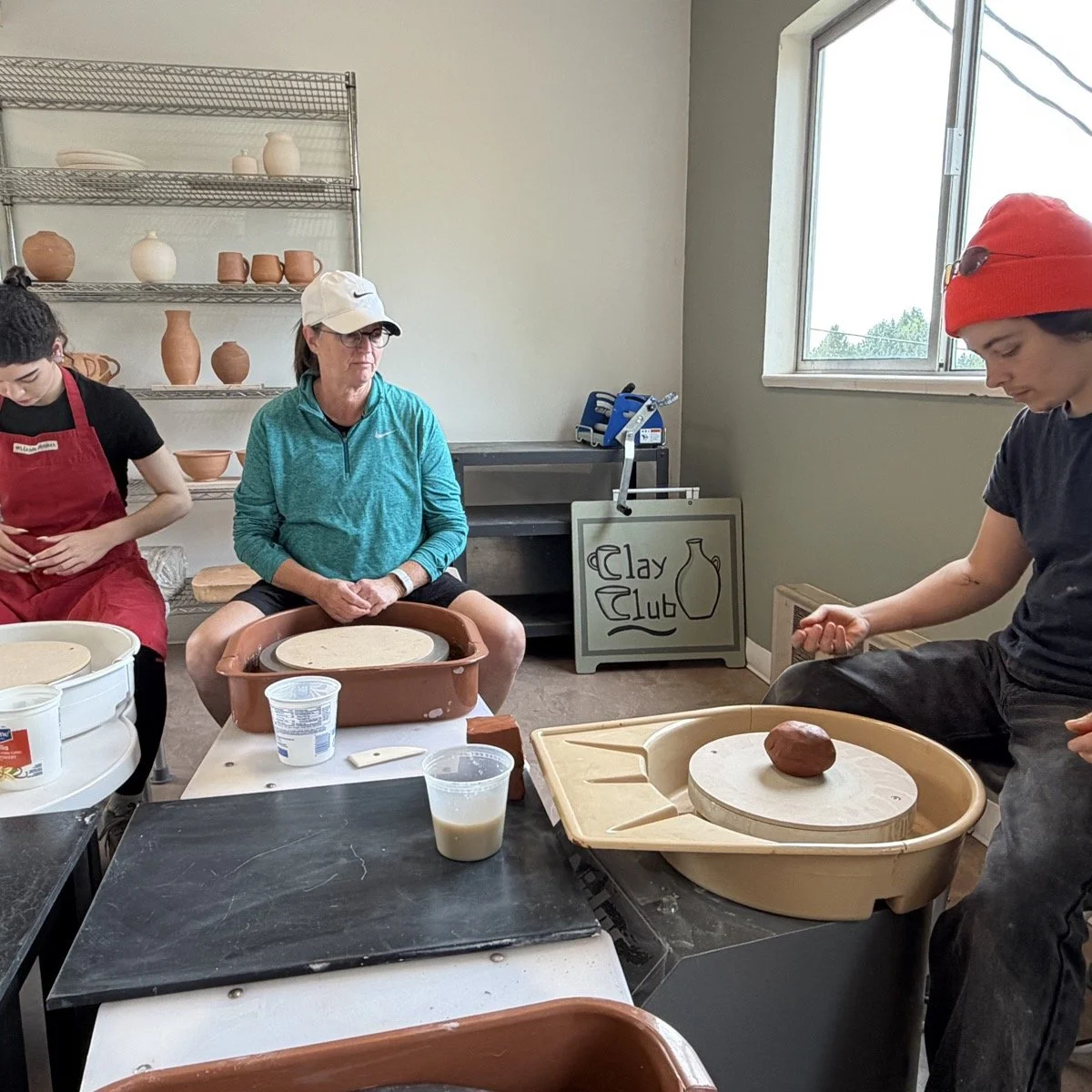 Clay Club students working at pottery wheels