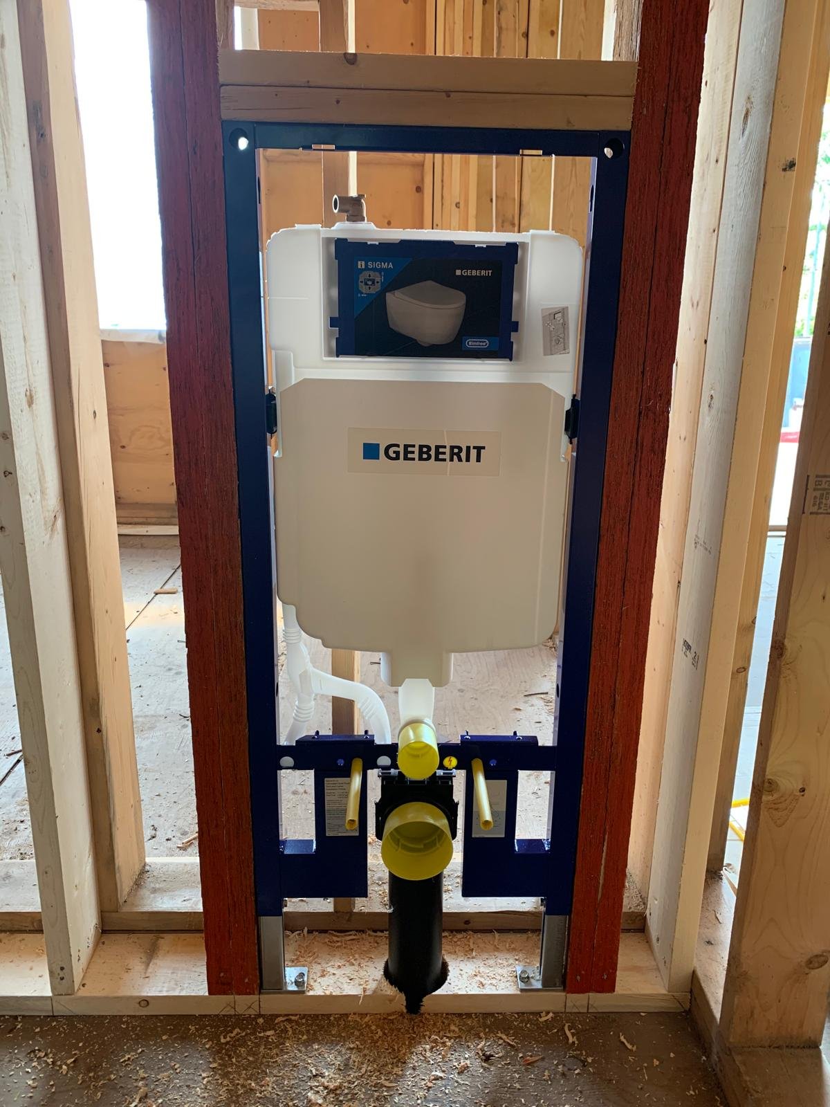 Wall-hung toilet carrier roughed in during a bathroom layout change