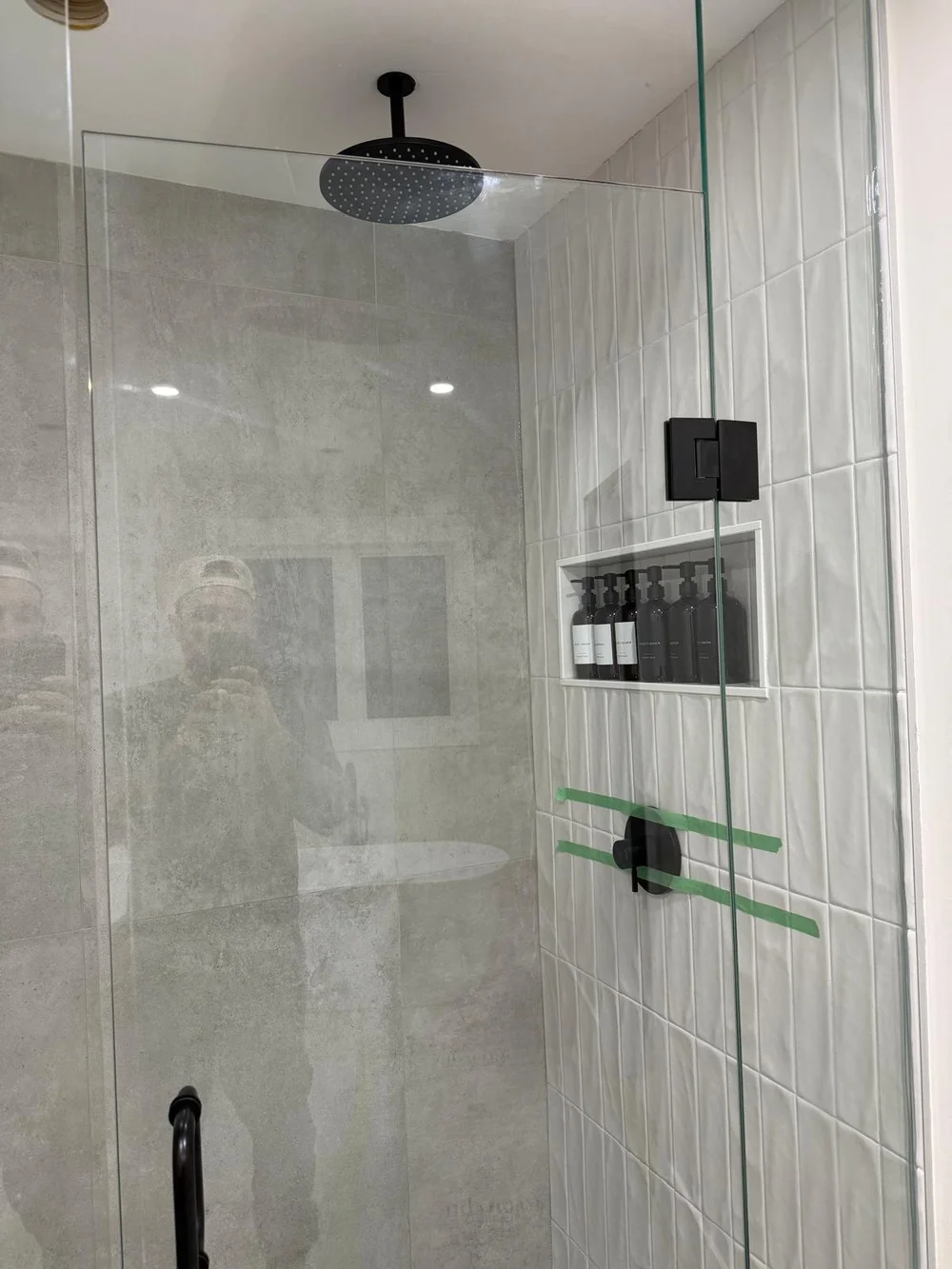 Finished glass walk-in shower after a bathroom renovation