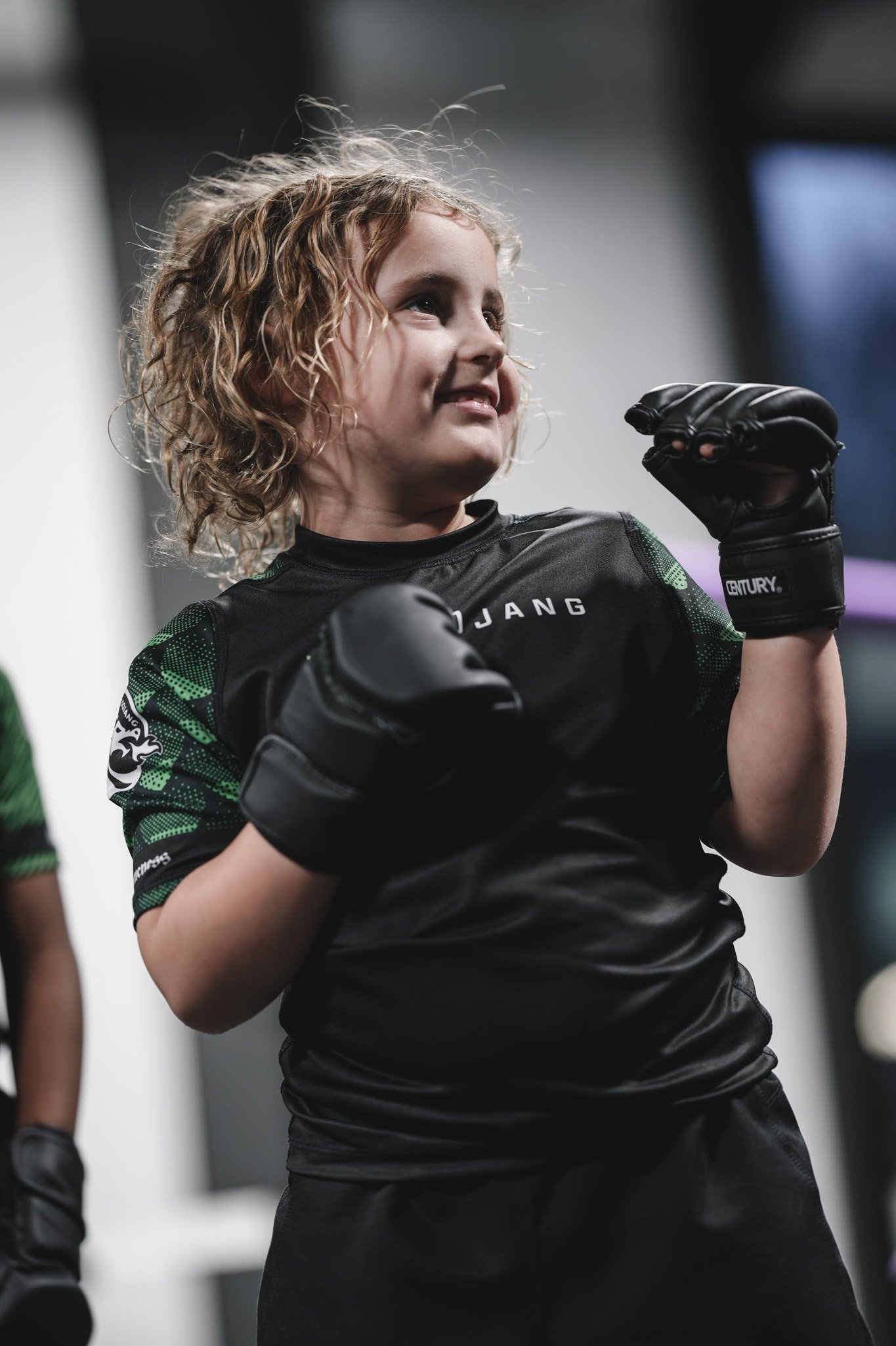 Young martial arts student with fists up at The Dojang Trussville
