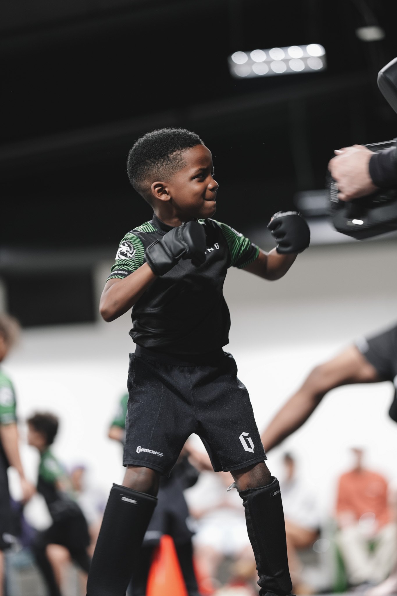 Smiling young student in a fighting stance at The Dojang Trussville