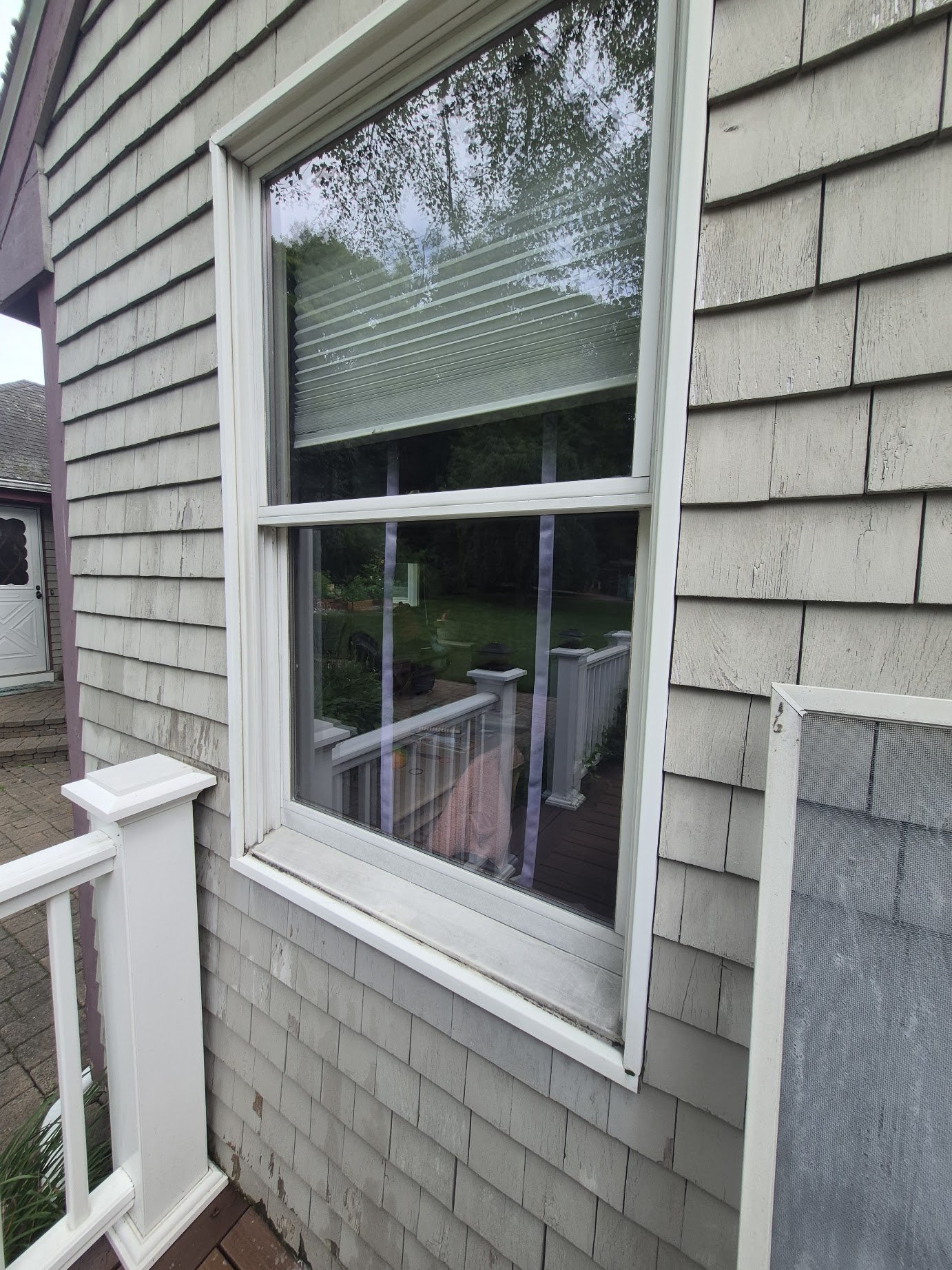 Clear residential window after professional cleaning by Jake’s Home Services