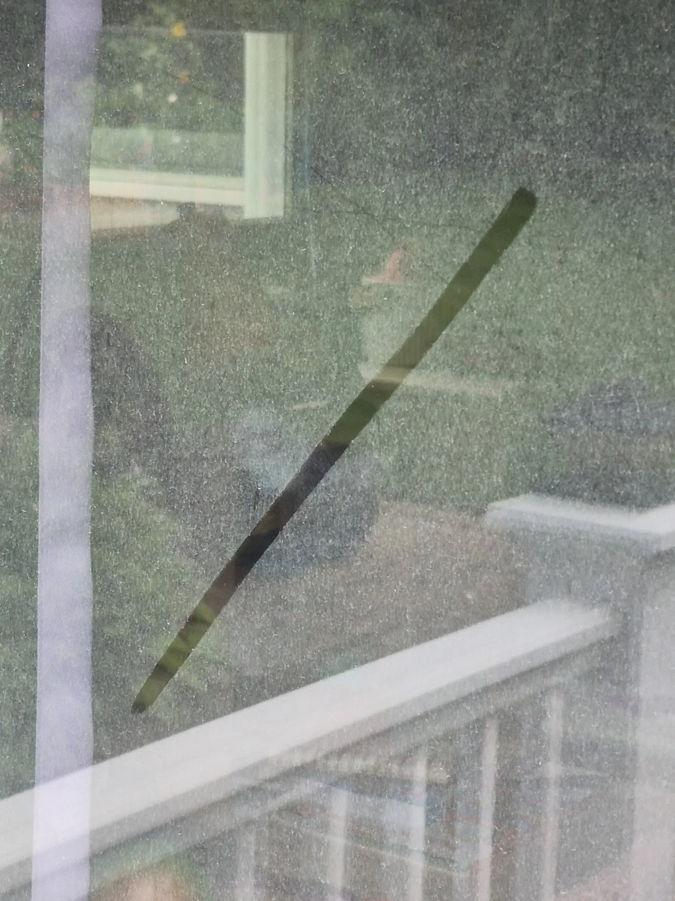 Dirty residential window before professional cleaning by Jake’s Home Services