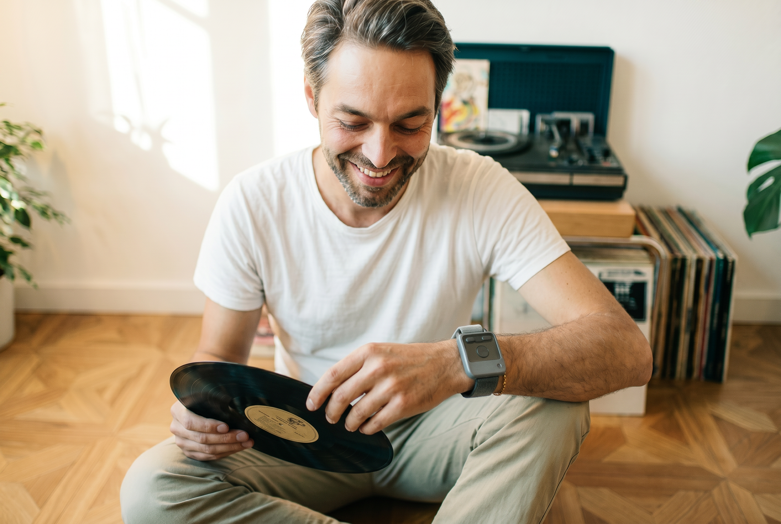 A man wearing Encora X1 while handling a record